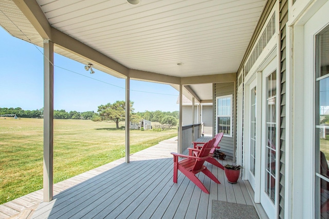 672 66th St, South Haven, MI 49090 - wooden deck featuring a yard