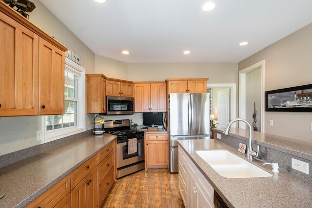 672 66th St, South Haven, MI 49090 - kitchen with stainless steel appliances, recessed lighting, and wood finished floors