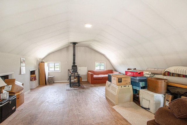672 66th St, South Haven, MI 49090 - additional living space featuring light wood finished floors, vaulted ceiling, and a wood stove