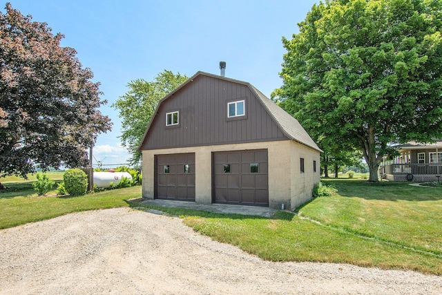 672 66th St, South Haven, MI 49090 - garage featuring a detached garage and dirt driveway