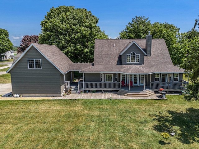 672 66th St, South Haven, MI 49090 - back of property featuring a yard, a chimney, french doors, and a wooden deck