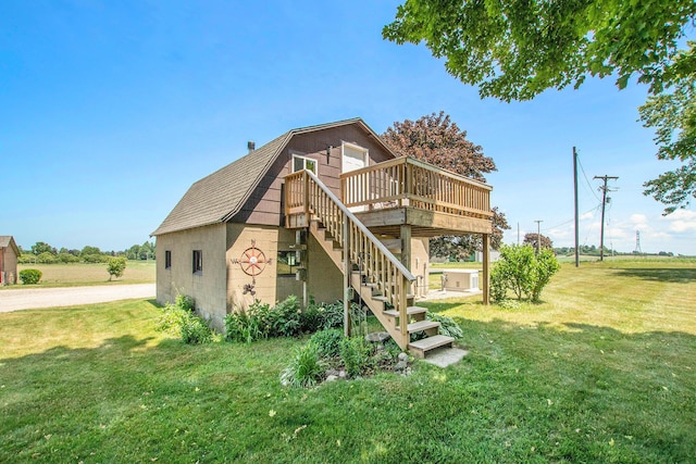672 66th St, South Haven, MI 49090 - rear view of property with a lawn, a wooden deck, stairway, and a gambrel roof