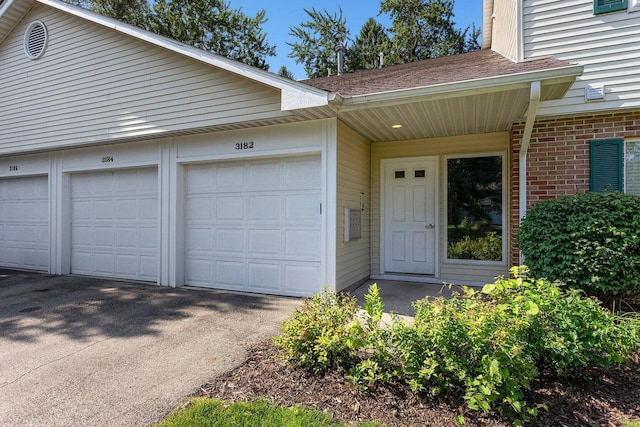 3184 Windcrest Dr # 14, Grand Rapids, MI 49525 - exterior space with brick siding and a garage