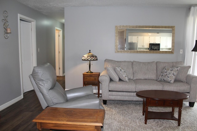 3184 Windcrest Dr # 14, Grand Rapids, MI 49525 - living room featuring baseboards and wood finished floors