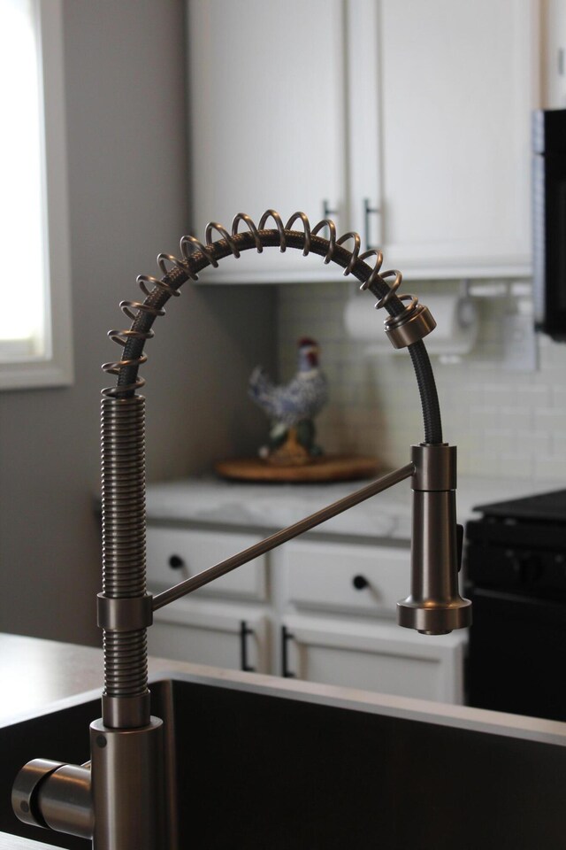 3184 Windcrest Dr # 14, Grand Rapids, MI 49525 - interior details with stainless steel microwave and light countertops