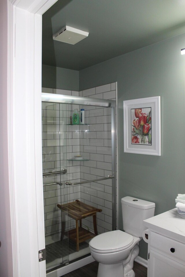 3184 Windcrest Dr # 14, Grand Rapids, MI 49525 - bathroom featuring toilet, a shower stall, and vanity