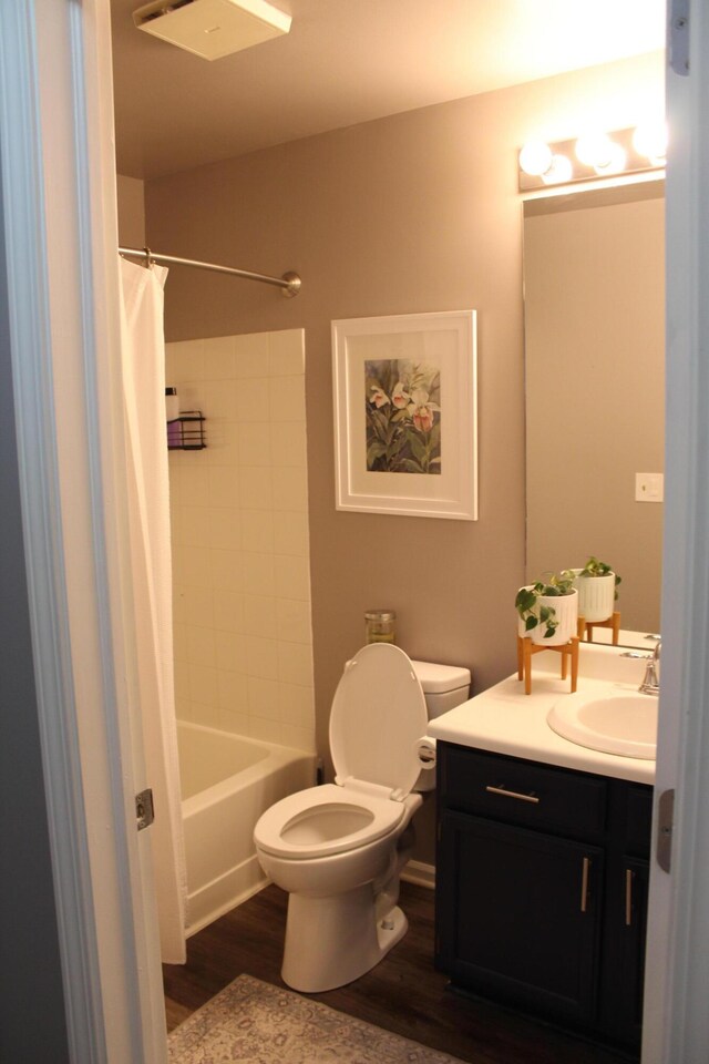 3184 Windcrest Dr # 14, Grand Rapids, MI 49525 - full bath with toilet, wood finished floors, vanity, and shower / bath combo with shower curtain