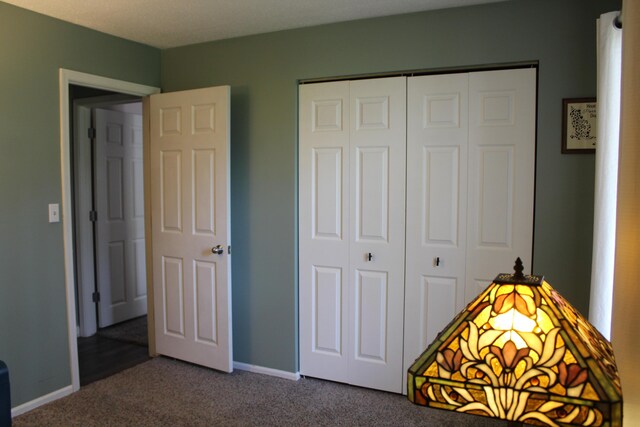 3184 Windcrest Dr # 14, Grand Rapids, MI 49525 - carpeted bedroom featuring a closet and baseboards