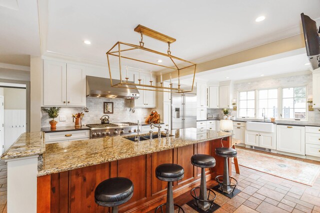 328 E 650 S, La Porte, IN 46350 - kitchen with a sink, backsplash, under cabinet range hood, and built in fridge