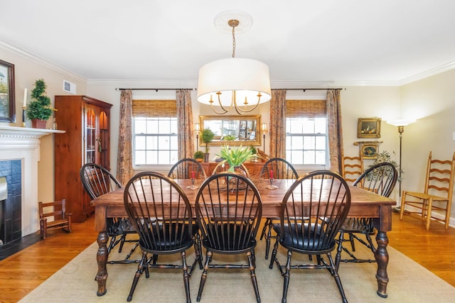 328 E 650 S, La Porte, IN 46350 - dining area featuring visible vents, a tile fireplace, wood finished floors, and a wealth of natural light