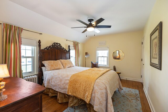 328 E 650 S, La Porte, IN 46350 - bedroom featuring baseboards, multiple windows, wood finished floors, and radiator
