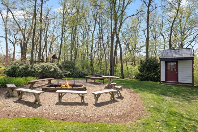 328 E 650 S, La Porte, IN 46350 - view of yard with a storage shed, an outdoor structure, and an outdoor fire pit