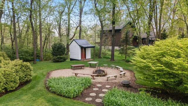 328 E 650 S, La Porte, IN 46350 - view of green lawn featuring a fire pit, a storage shed, and an outdoor structure