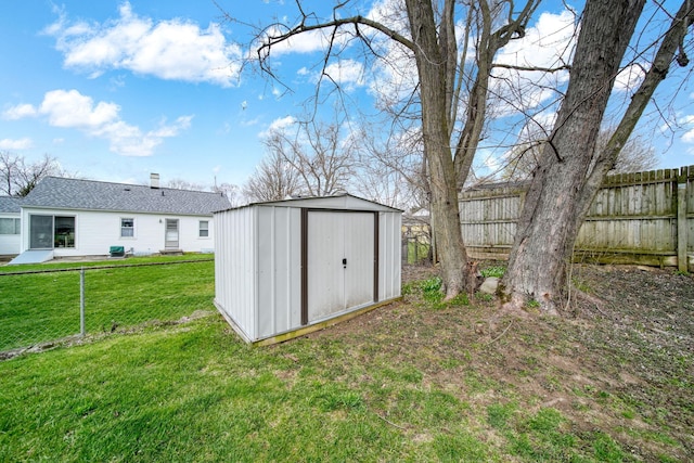view of shed featuring fence private yard