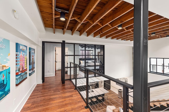 22 Jefferson Ave SE, Grand Rapids, MI 49503 - corridor featuring an upstairs landing, wooden ceiling with exposed beams, wood finished floors, healthy amount of natural light, and baseboards