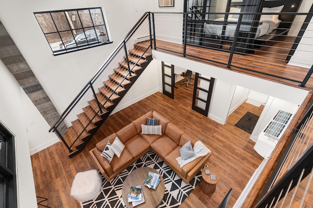 22 Jefferson Ave SE, Grand Rapids, MI 49503 - living room featuring baseboards, wood finished floors, and stairs