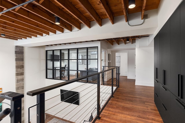 22 Jefferson Ave SE, Grand Rapids, MI 49503 - corridor with an upstairs landing, dark wood-type flooring, wood ceiling with exposed beams, and baseboards