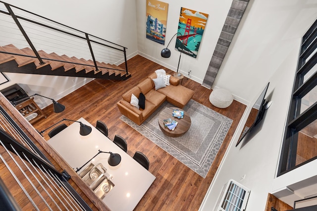 22 Jefferson Ave SE, Grand Rapids, MI 49503 - living room with wood finished floors, stairway, and baseboards