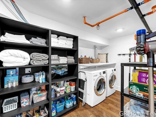 22 Jefferson Ave SE, Grand Rapids, MI 49503 - washroom featuring washing machine and dryer and wood finished floors