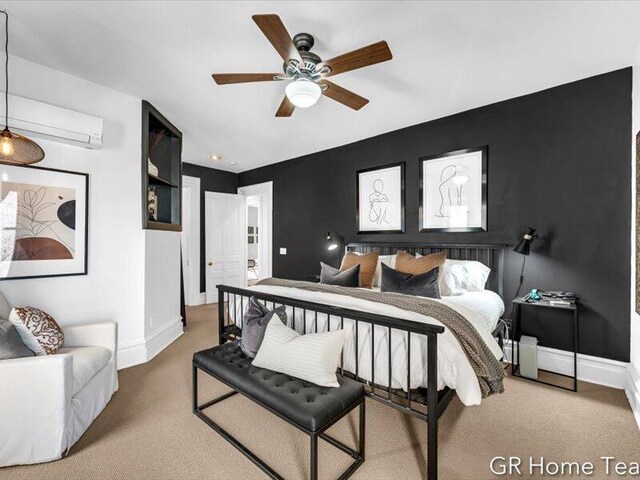 22 Jefferson Ave SE, Grand Rapids, MI 49503 - bedroom with a wall mounted air conditioner, carpet, baseboards, and a ceiling fan