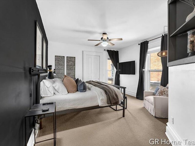 22 Jefferson Ave SE, Grand Rapids, MI 49503 - bedroom with carpet, baseboards, and a ceiling fan