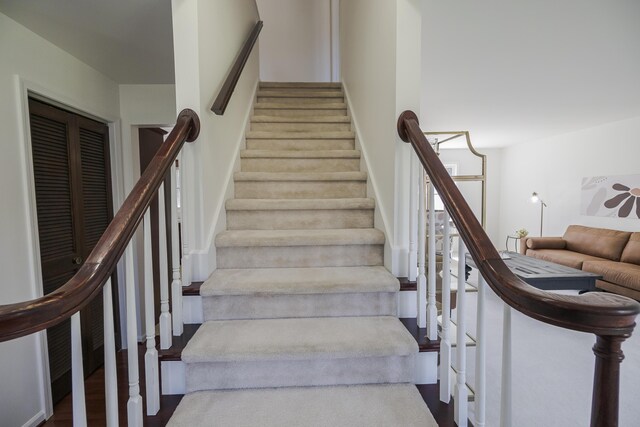 16230 Woodcrest Dr, Spring Lake, MI 49456 - staircase featuring wood finished floors