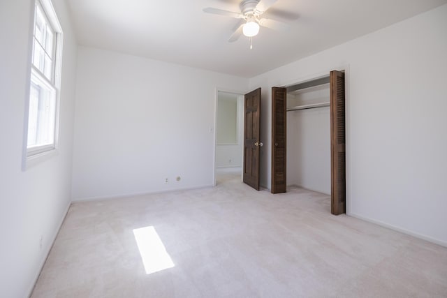 16230 Woodcrest Dr, Spring Lake, MI 49456 - unfurnished bedroom featuring ceiling fan, a closet, and carpet