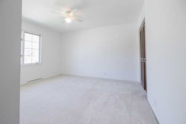16230 Woodcrest Dr, Spring Lake, MI 49456 - spare room featuring a ceiling fan and light colored carpet