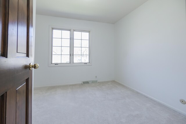 16230 Woodcrest Dr, Spring Lake, MI 49456 - empty room featuring visible vents, carpet flooring, and baseboards
