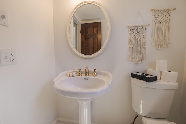 16230 Woodcrest Dr, Spring Lake, MI 49456 - half bathroom with toilet and a sink