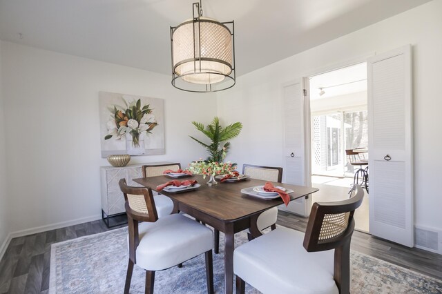 16230 Woodcrest Dr, Spring Lake, MI 49456 - dining room with wood finished floors, visible vents, and baseboards