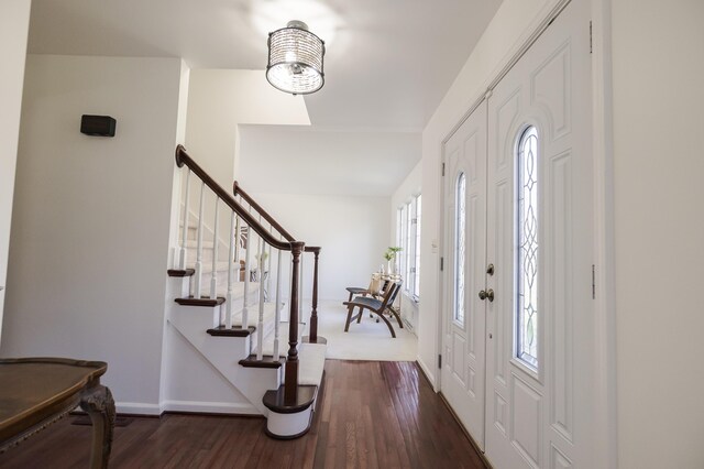 16230 Woodcrest Dr, Spring Lake, MI 49456 - foyer entrance featuring baseboards, wood finished floors, and stairs