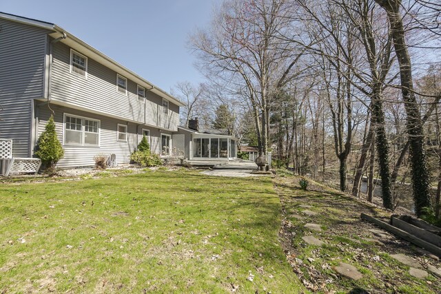 16230 Woodcrest Dr, Spring Lake, MI 49456 - view of yard with a sunroom