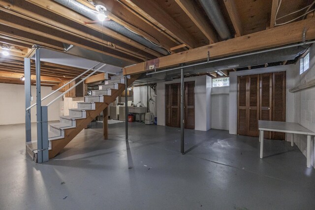 16230 Woodcrest Dr, Spring Lake, MI 49456 - basement with stairway and a sink