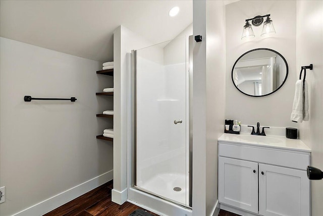 16325 Stones Throw Ln, Union Pier, MI 49129 - bathroom with baseboards, vanity, wood finished floors, and a stall shower