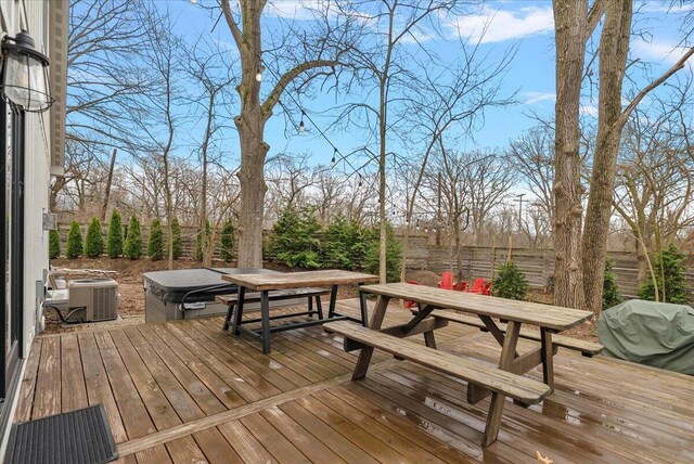 16325 Stones Throw Ln, Union Pier, MI 49129 - wooden deck featuring area for grilling, outdoor dining area, cooling unit, and a covered hot tub