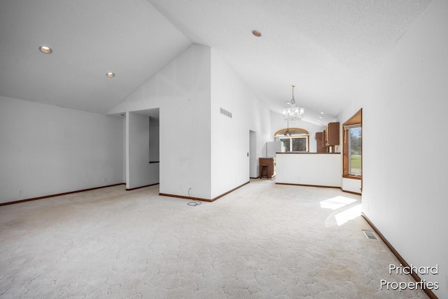unfurnished living room with lofted ceiling, light carpet, visible vents, and an inviting chandelier
