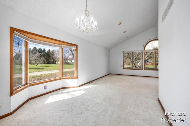 empty room with lofted ceiling, visible vents, carpet, and a notable chandelier