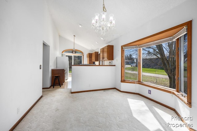 interior space with lofted ceiling, light carpet, baseboards, and a chandelier