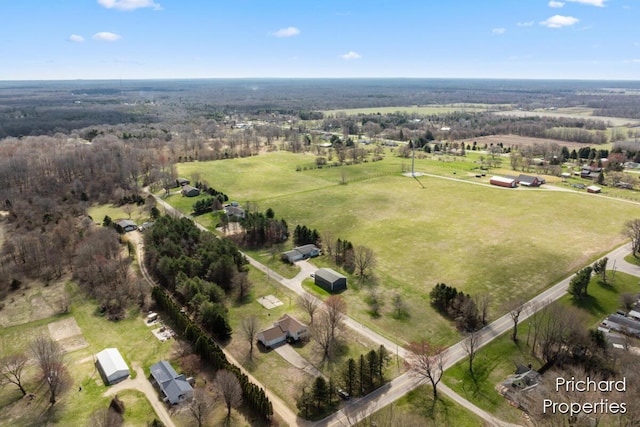 birds eye view of property with a rural view