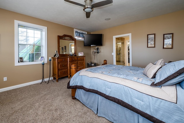 bedroom with baseboards and light carpet