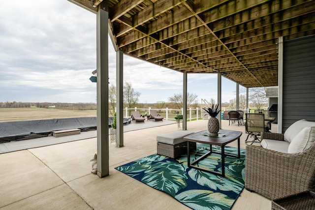 view of patio / terrace featuring an outdoor living space and fence