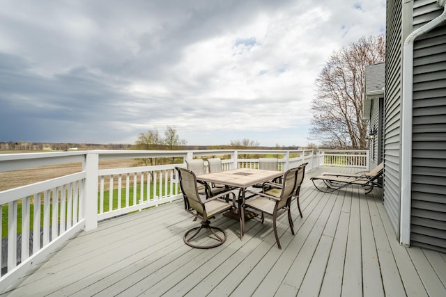 deck featuring outdoor dining area