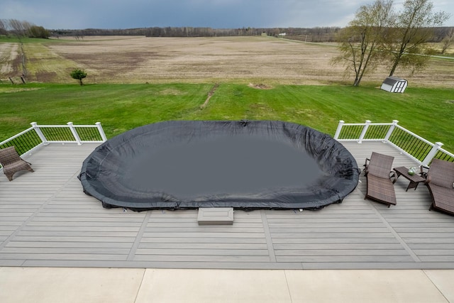 exterior space featuring a lawn and a rural view