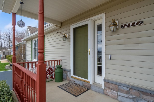 10951 N Waldron Rd, Jerome, MI 49249 - view of exterior entry with a porch