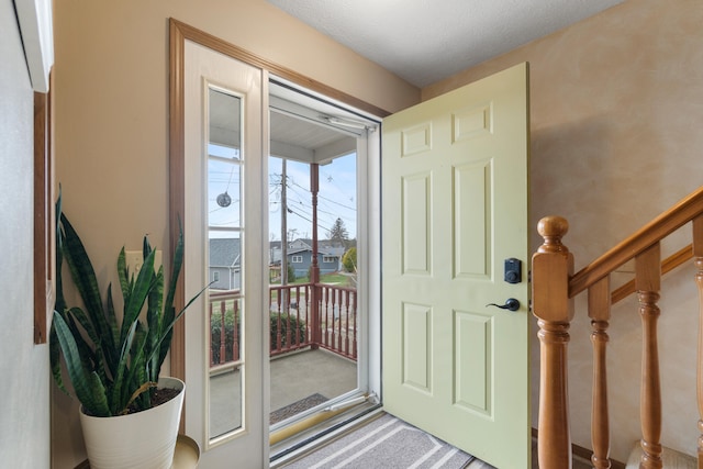 10951 N Waldron Rd, Jerome, MI 49249 - doorway to outside with stairway and carpet flooring