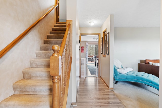 10951 N Waldron Rd, Jerome, MI 49249 - staircase featuring wood finished floors and baseboards