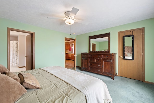 10951 N Waldron Rd, Jerome, MI 49249 - carpeted bedroom featuring ceiling fan, baseboards, and ensuite bathroom
