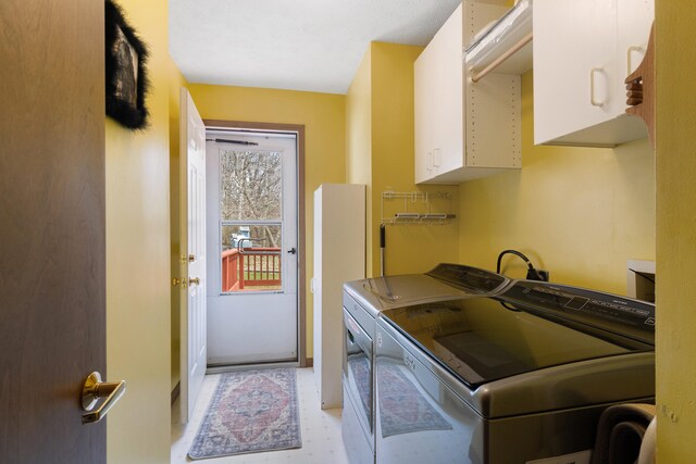 10951 N Waldron Rd, Jerome, MI 49249 - laundry room with light floors, washer and dryer, and cabinet space
