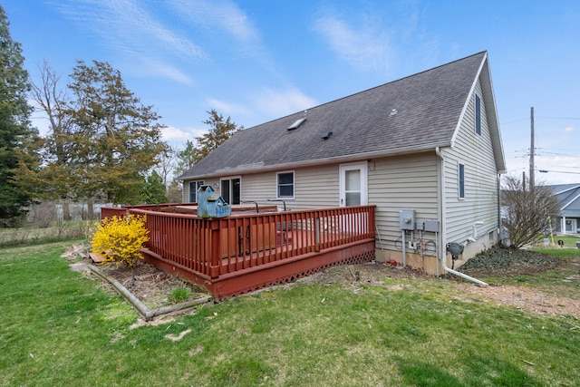 10951 N Waldron Rd, Jerome, MI 49249 - rear view of house featuring a wooden deck, a yard, and a shingled roof